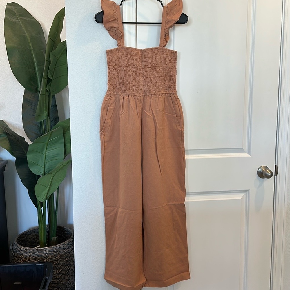 NWOT Pink Lily Jumpsuit. Size Large. Tan. Has pockets. Never worn.